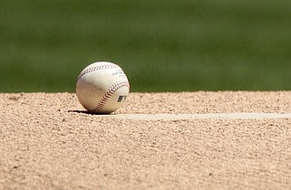 A baseball is shown on a pitcher's mound in this April 30, 2011 file photo. (AP/Jeff Chiu)